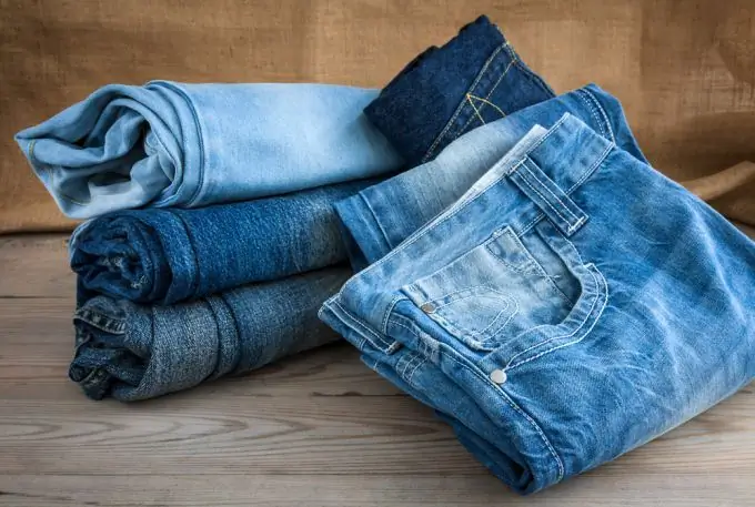 New life for old things. Making fashionable pants from worn jeans