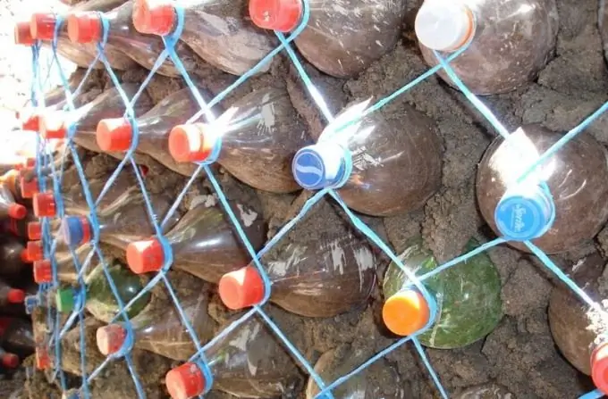 How to make a retaining wall from plastic bottles